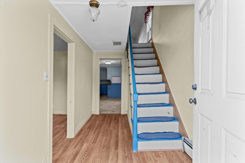 79 Beacon Street Lawrence, MA 01843 - Photo 15 of 29 a view of entryway and hall with wooden floor