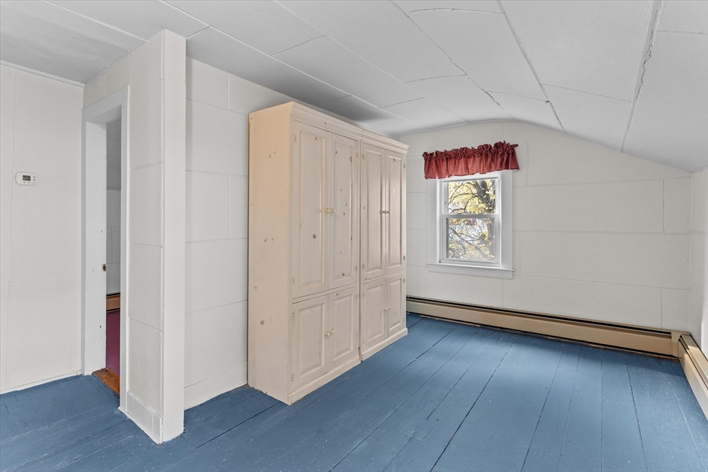 79 Beacon Street Lawrence, MA 01843 - Photo 16 of 29 an empty room with wooden floor and windows