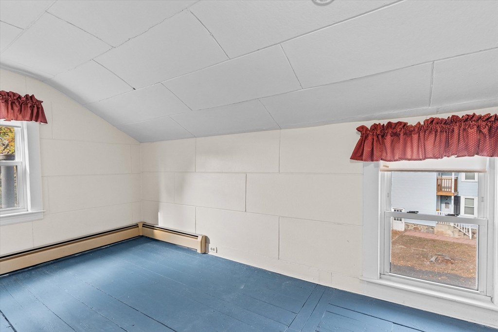 79 Beacon Street Lawrence, MA 01843 - Photo 17 of 29 wooden floor in an empty room with a window