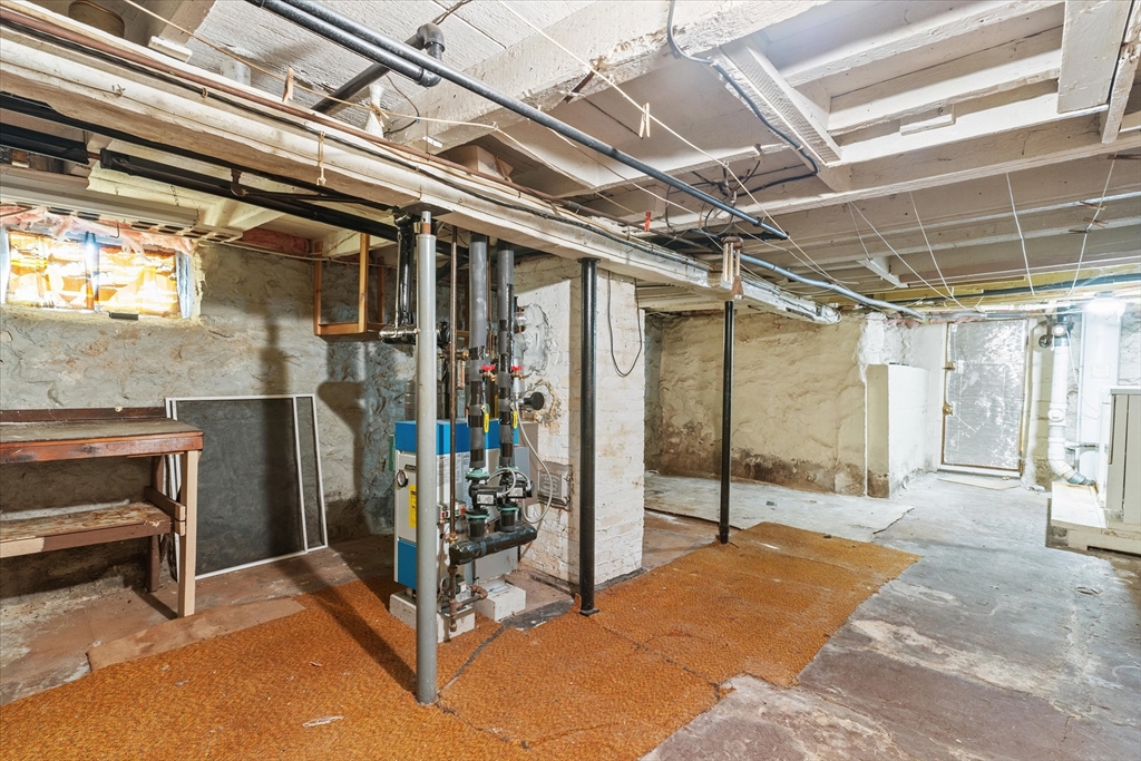 79 Beacon Street Lawrence, MA 01843 - Photo 23 of 29 a view of a hallway with wooden floors