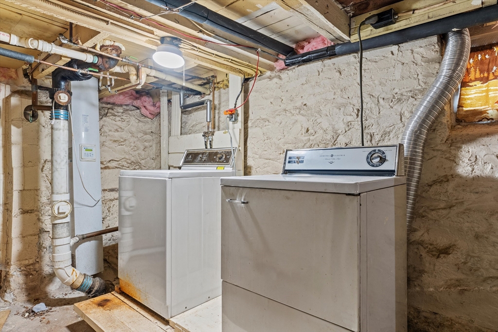 79 Beacon Street Lawrence, MA 01843 - Photo 25 of 29 a utility room with dryer and washer