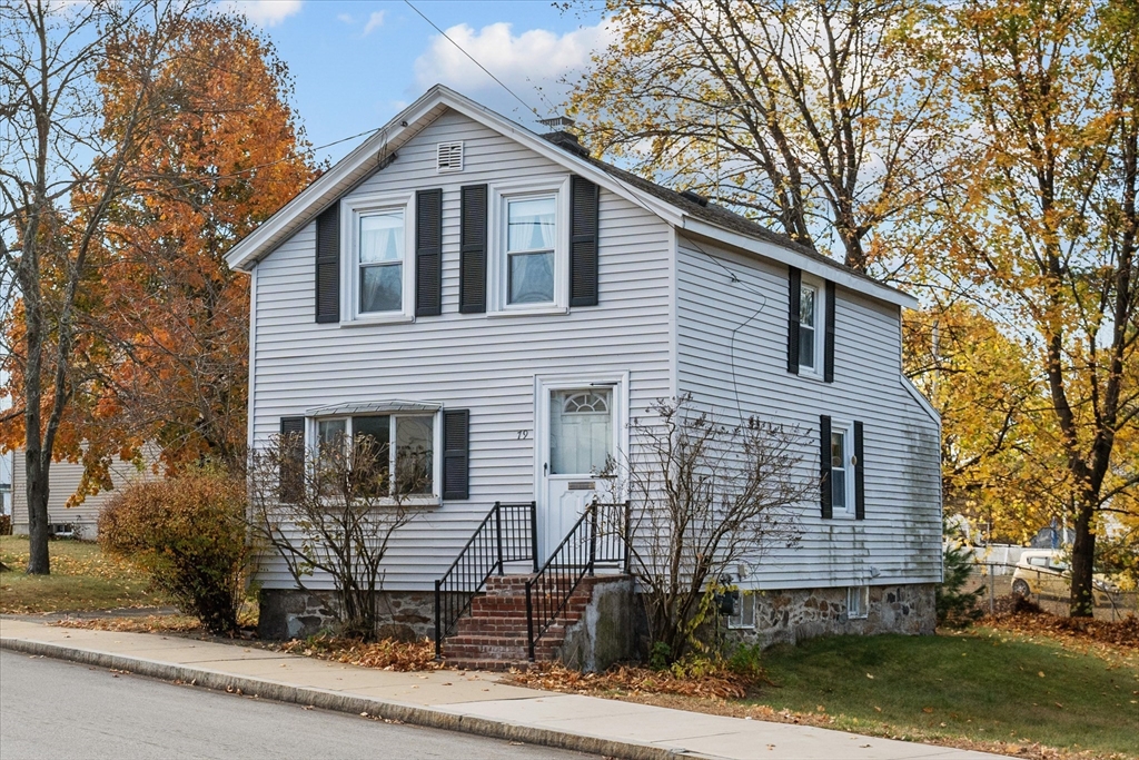 79 Beacon Street Lawrence, MA 01843 - Photo 3 of 29 a front view of a house with garage