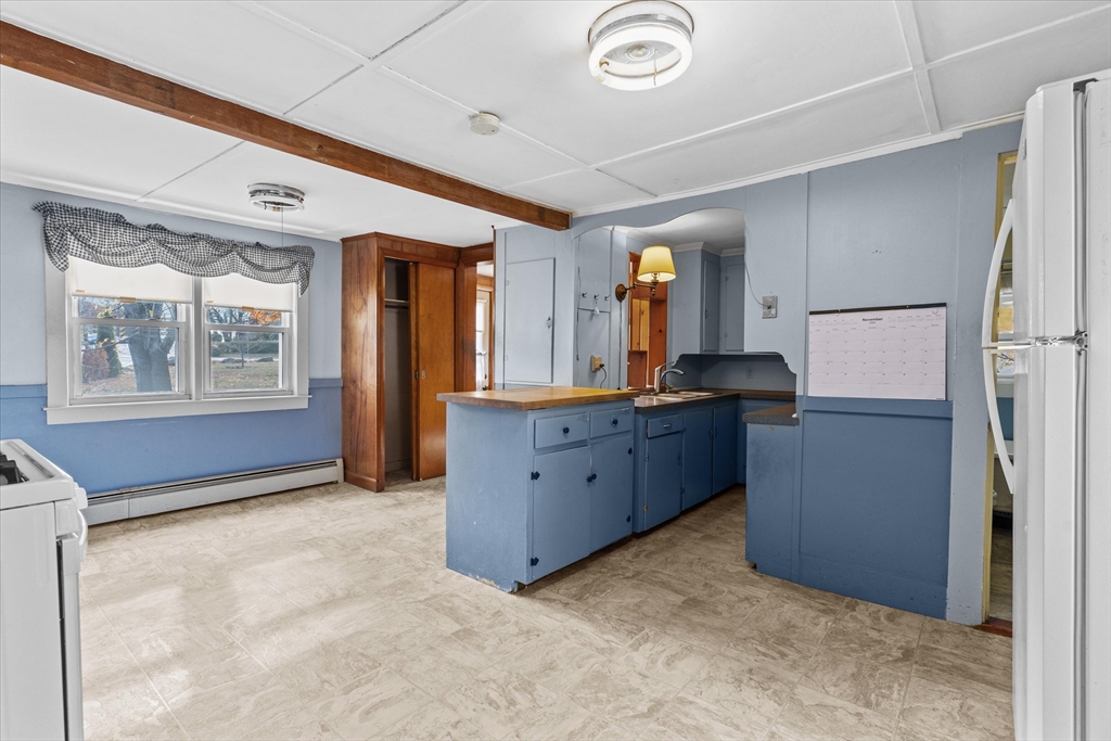 79 Beacon Street Lawrence, MA 01843 - Photo 8 of 29 a kitchen with stainless steel appliances granite countertop a refrigerator and a stove
