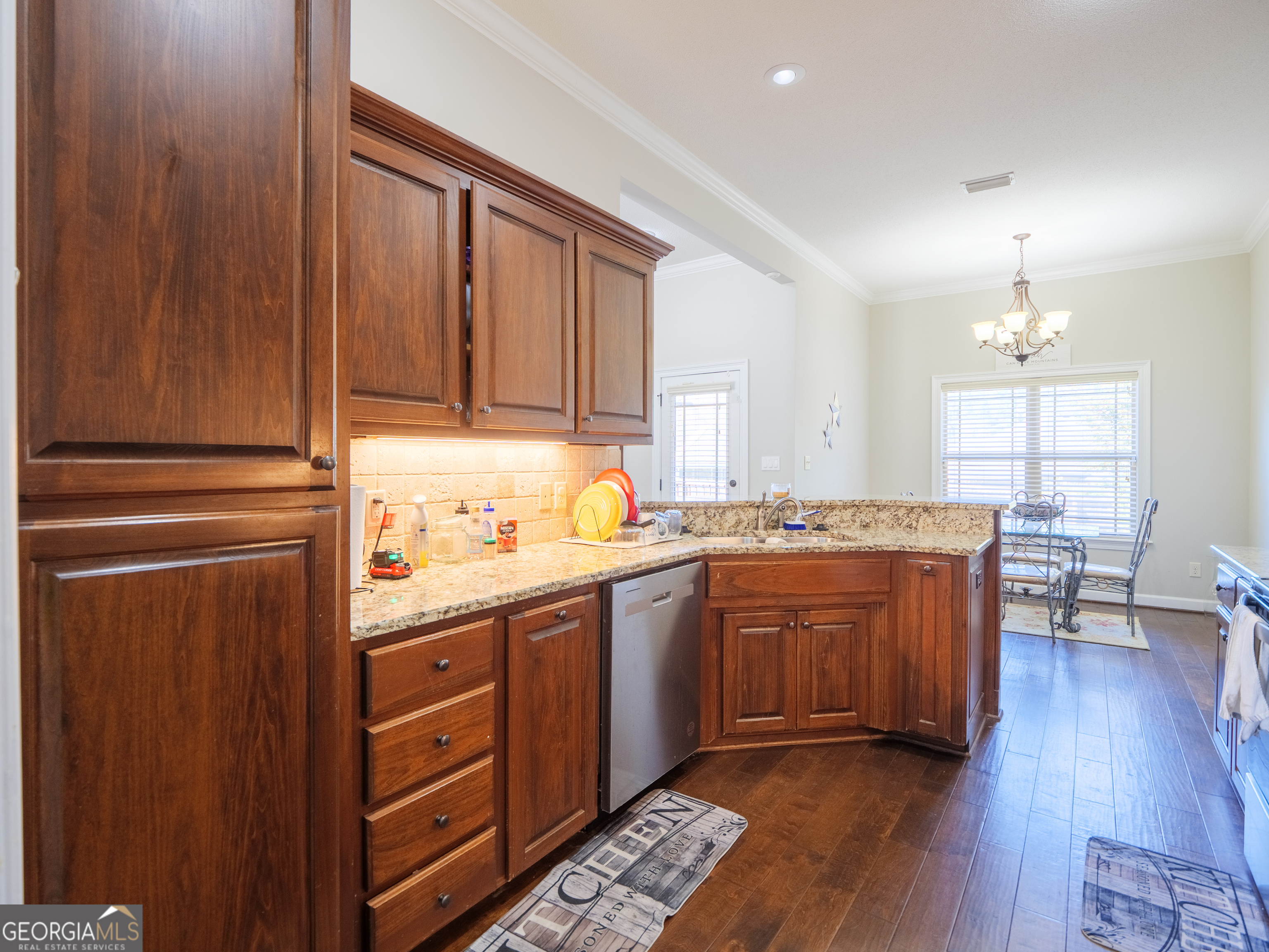 4049 Applecross Road Valdosta, GA 31605 - Photo 18 of 48 a kitchen with stainless steel appliances granite countertop wooden cabinets a sink and dishwasher
