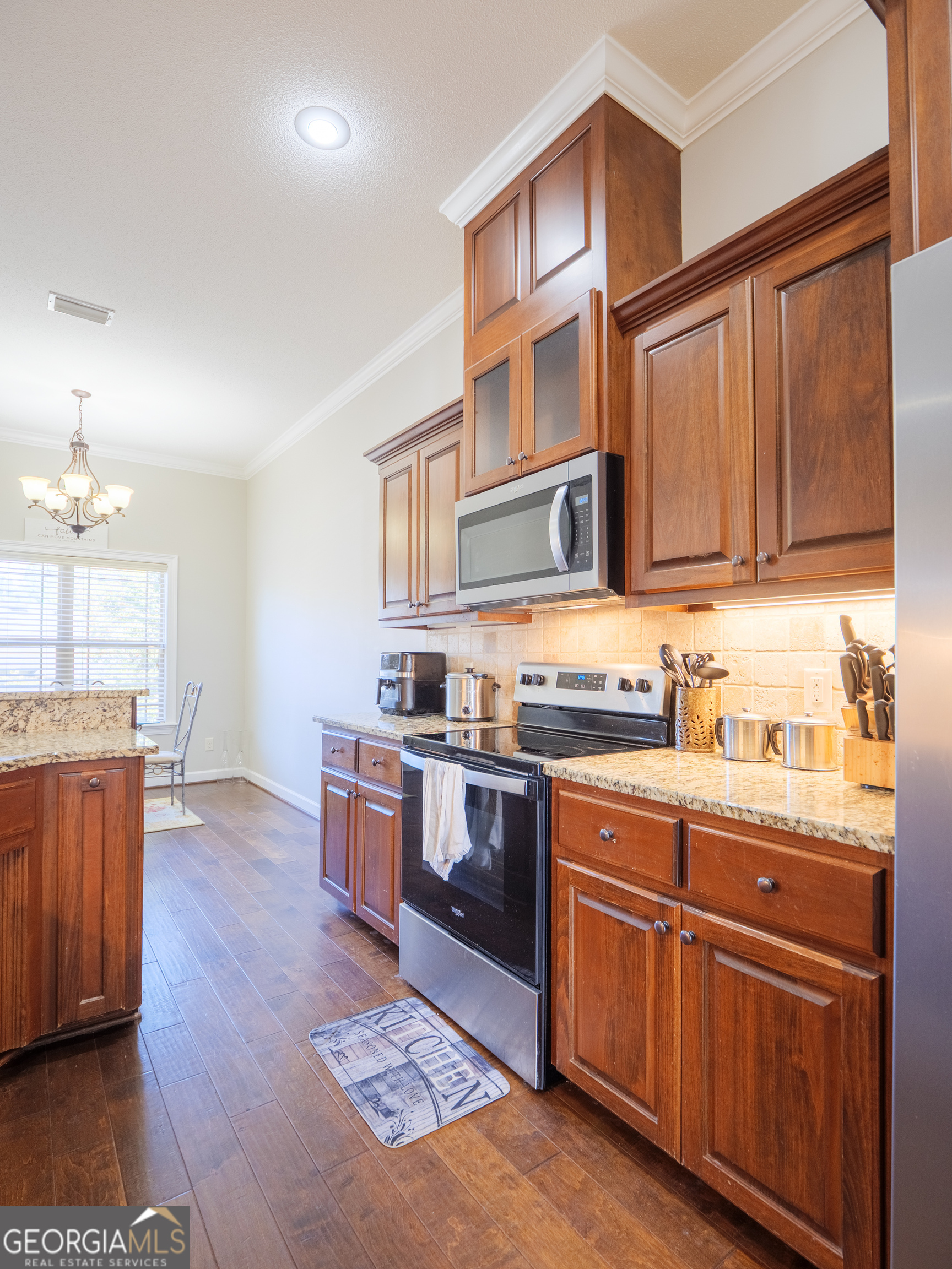 4049 Applecross Road Valdosta, GA 31605 - Photo 20 of 48 a kitchen with stainless steel appliances granite countertop a stove a sink dishwasher and a refrigerator