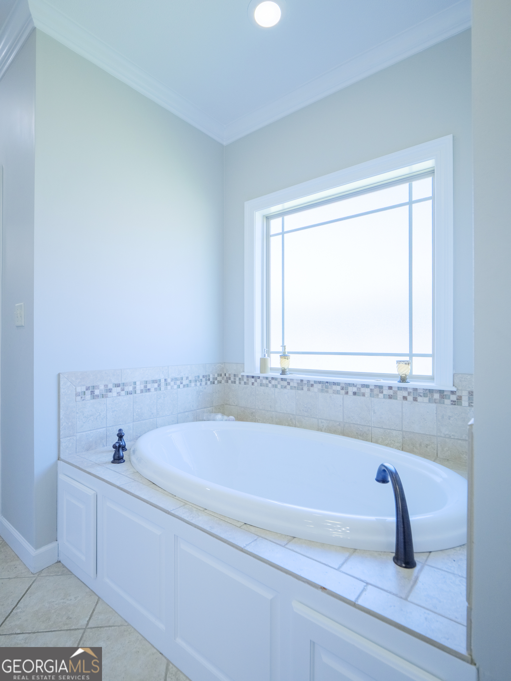 4049 Applecross Road Valdosta, GA 31605 - Photo 32 of 48 a white bath tub sitting next to a window