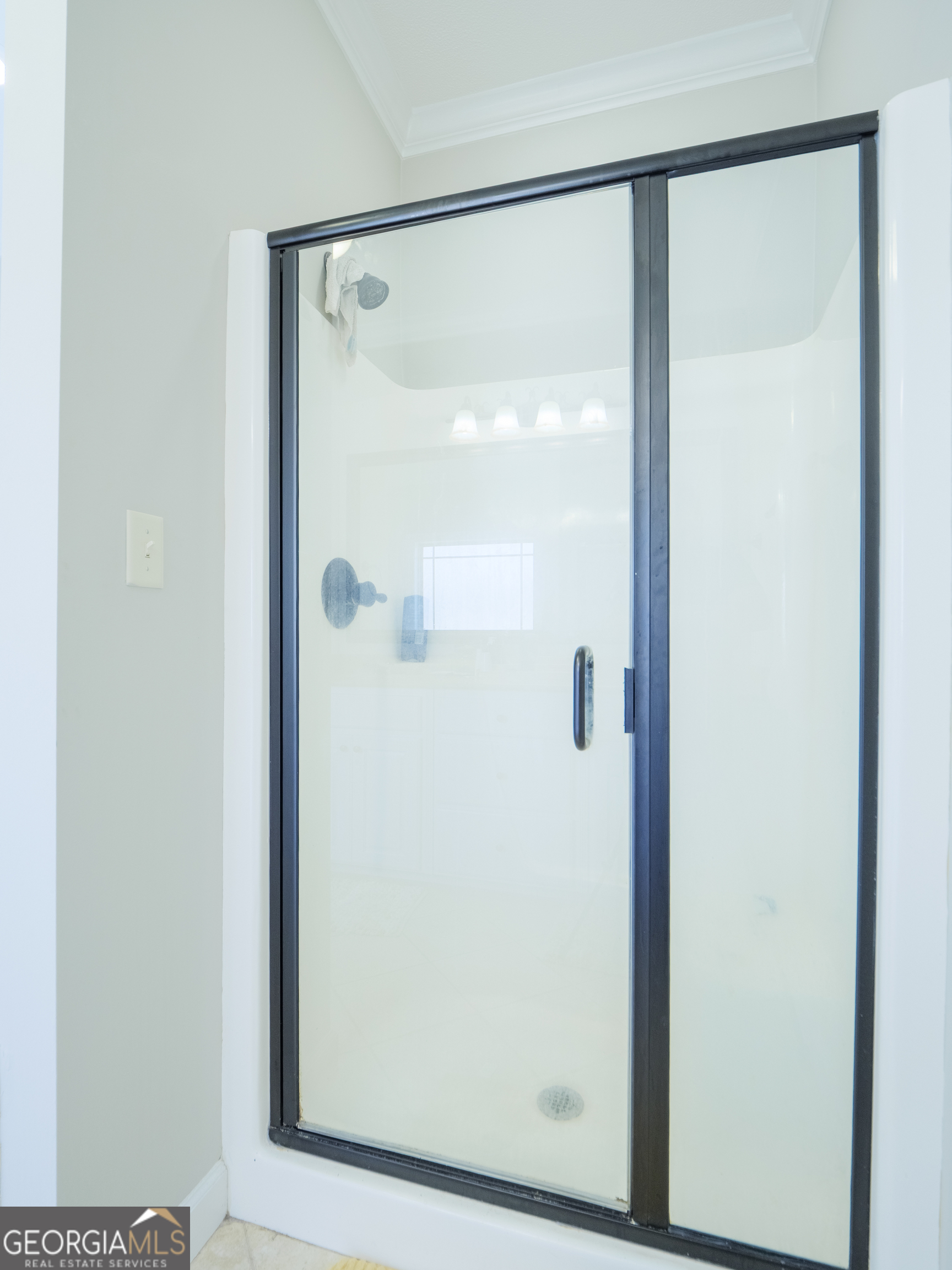 4049 Applecross Road Valdosta, GA 31605 - Photo 35 of 48 a bathroom with a glass shower door