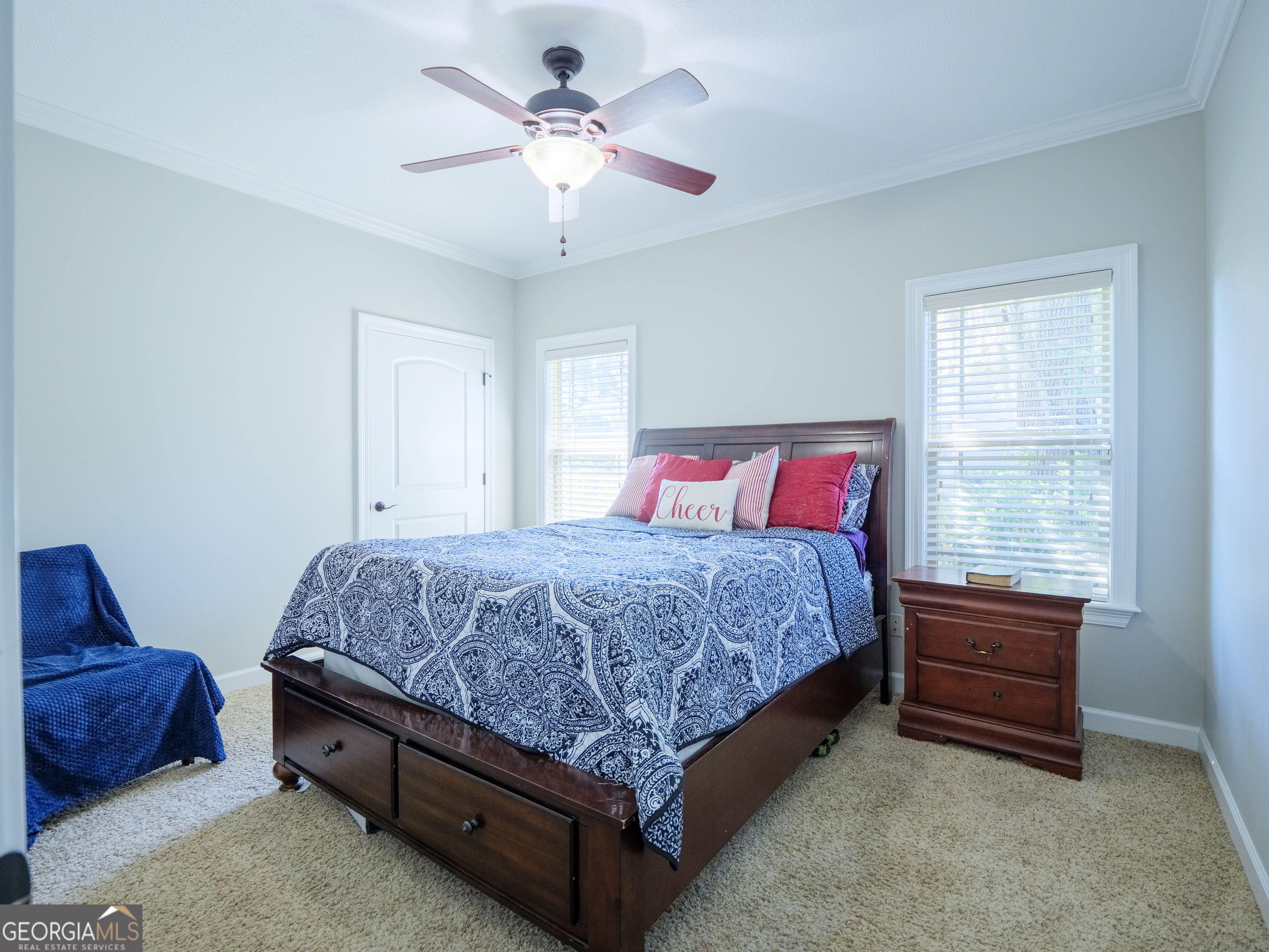 4049 Applecross Road Valdosta, GA 31605 - Photo 44 of 48 a spacious bedroom with a bed and a chandelier