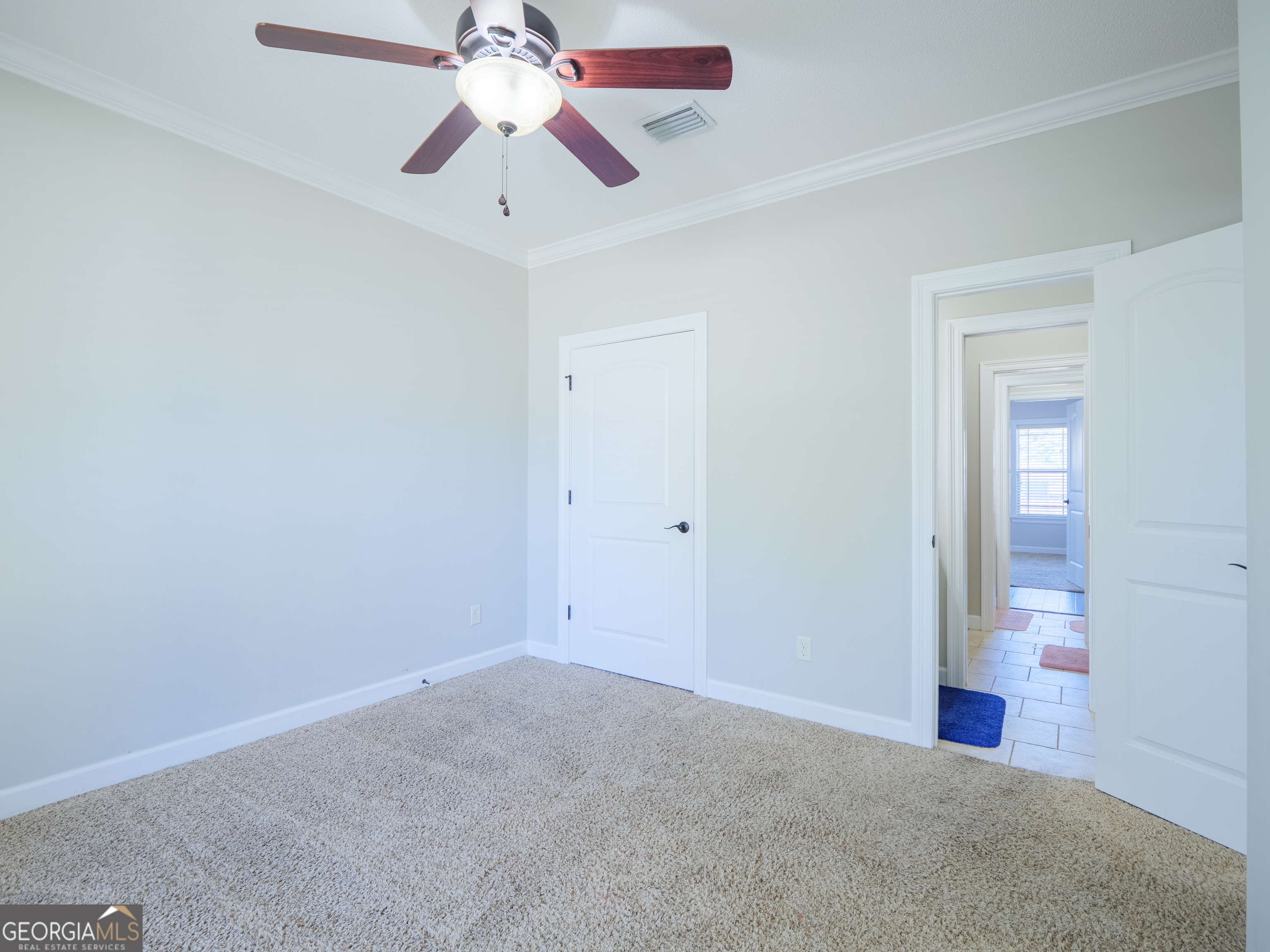 4049 Applecross Road Valdosta, GA 31605 - Photo 48 of 48 an empty room with closet and a chandelier fan