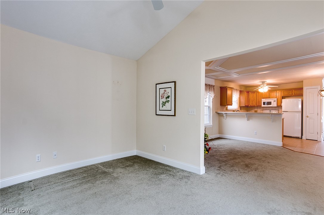 708 Rivers Edge Lane Painesville, OH 44077 - Photo 9 of 24 View from sun room to great room overlooking kitchen.