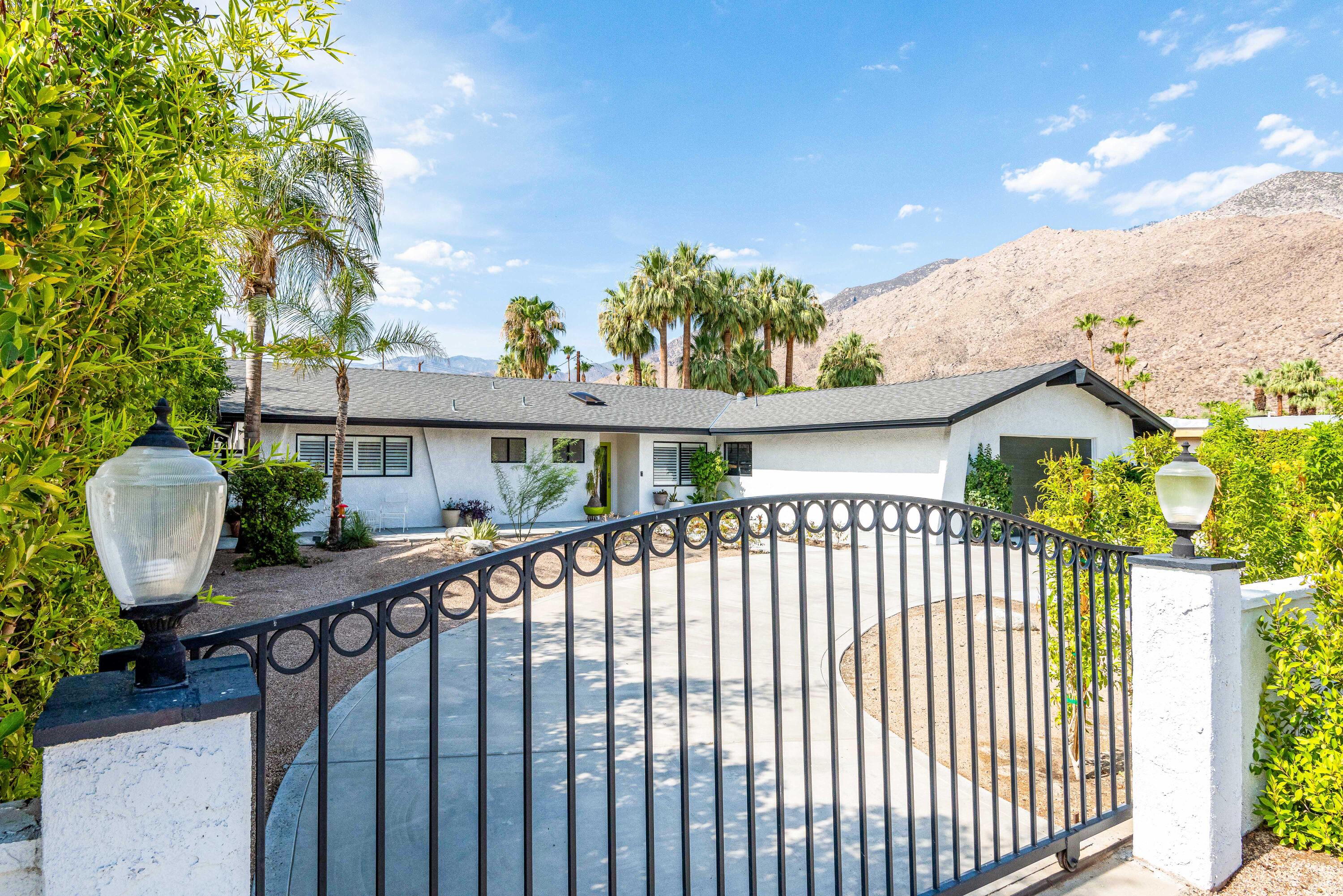 263 East Morongo Road Palm Springs, CA 92264 - Photo 2 of 29 a view of a roof deck with wooden fence and plants