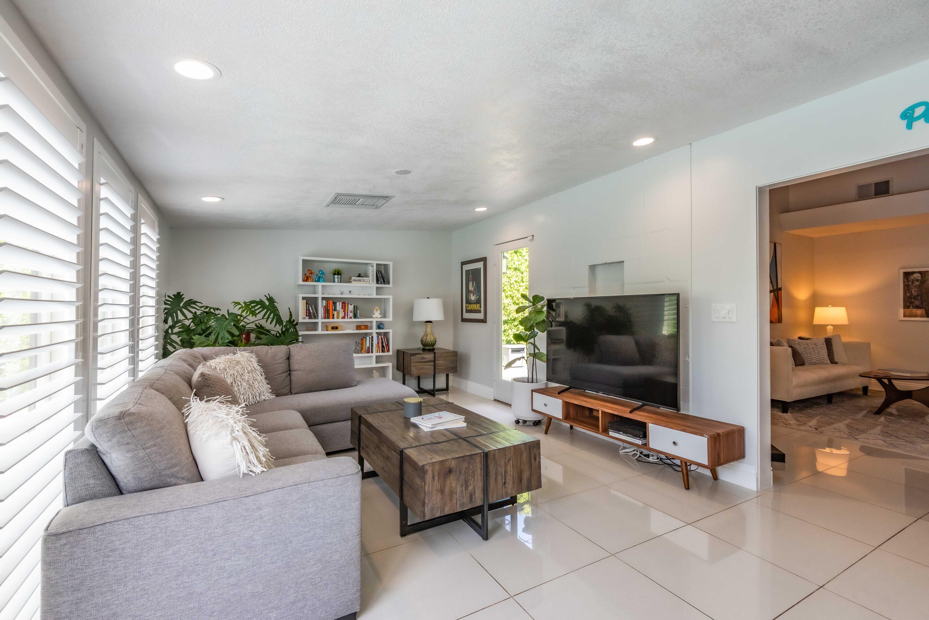 263 East Morongo Road Palm Springs, CA 92264 - Photo 11 of 29 a living room with furniture and a flat screen tv