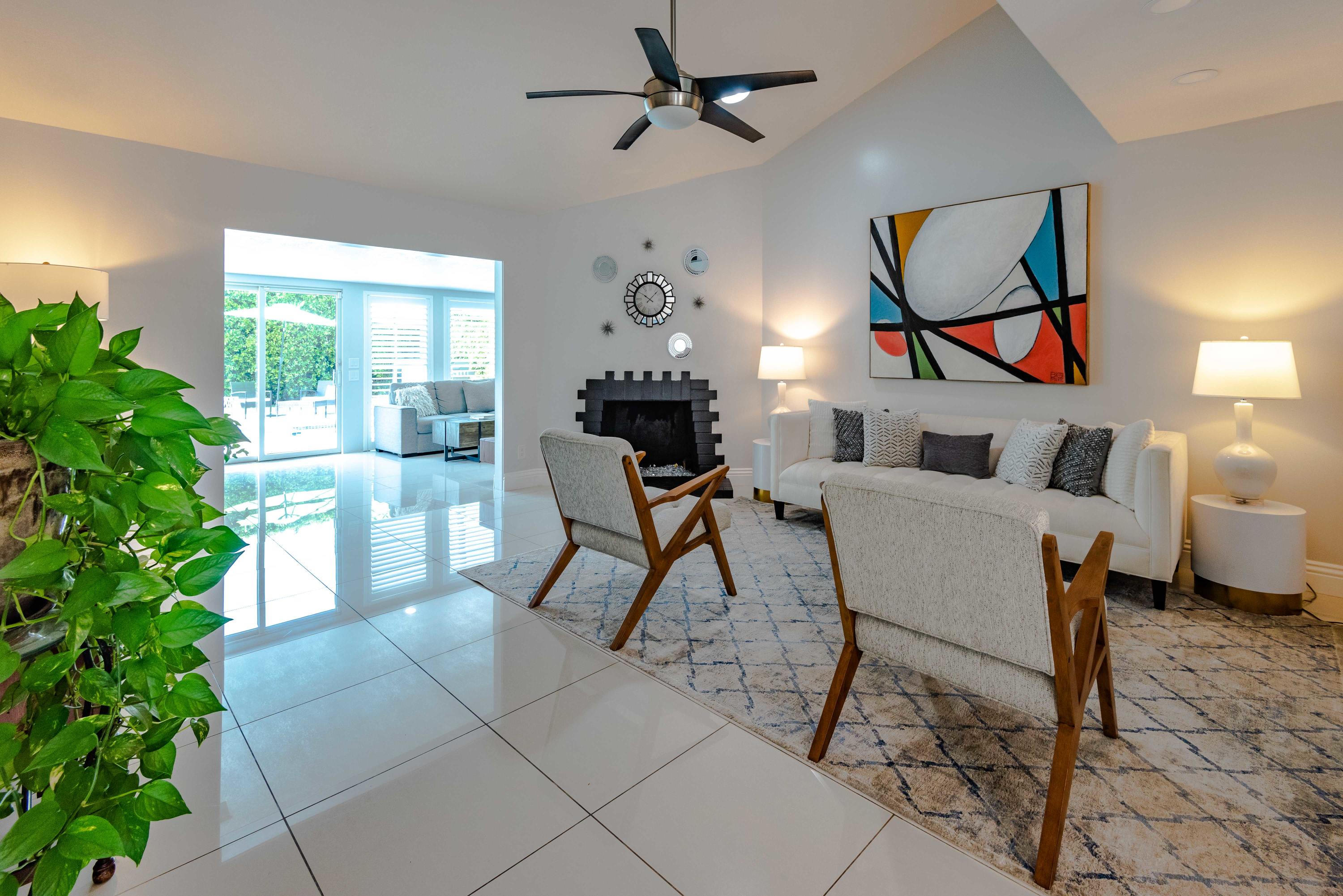 263 East Morongo Road Palm Springs, CA 92264 - Photo 3 of 29 a living room with patio furniture and a potted plant