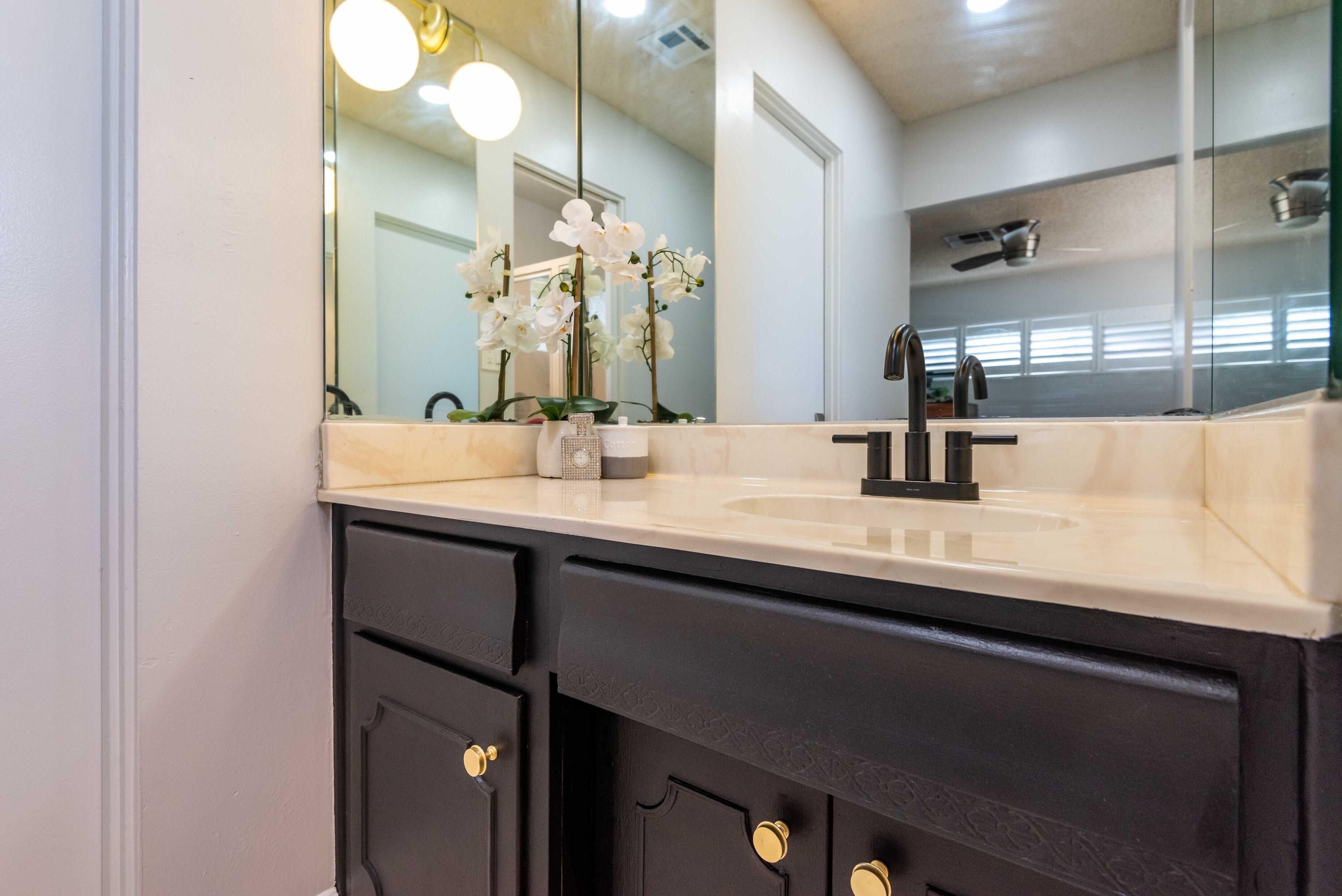 263 East Morongo Road Palm Springs, CA 92264 - Photo 22 of 29 a bathroom with a sink and a mirror