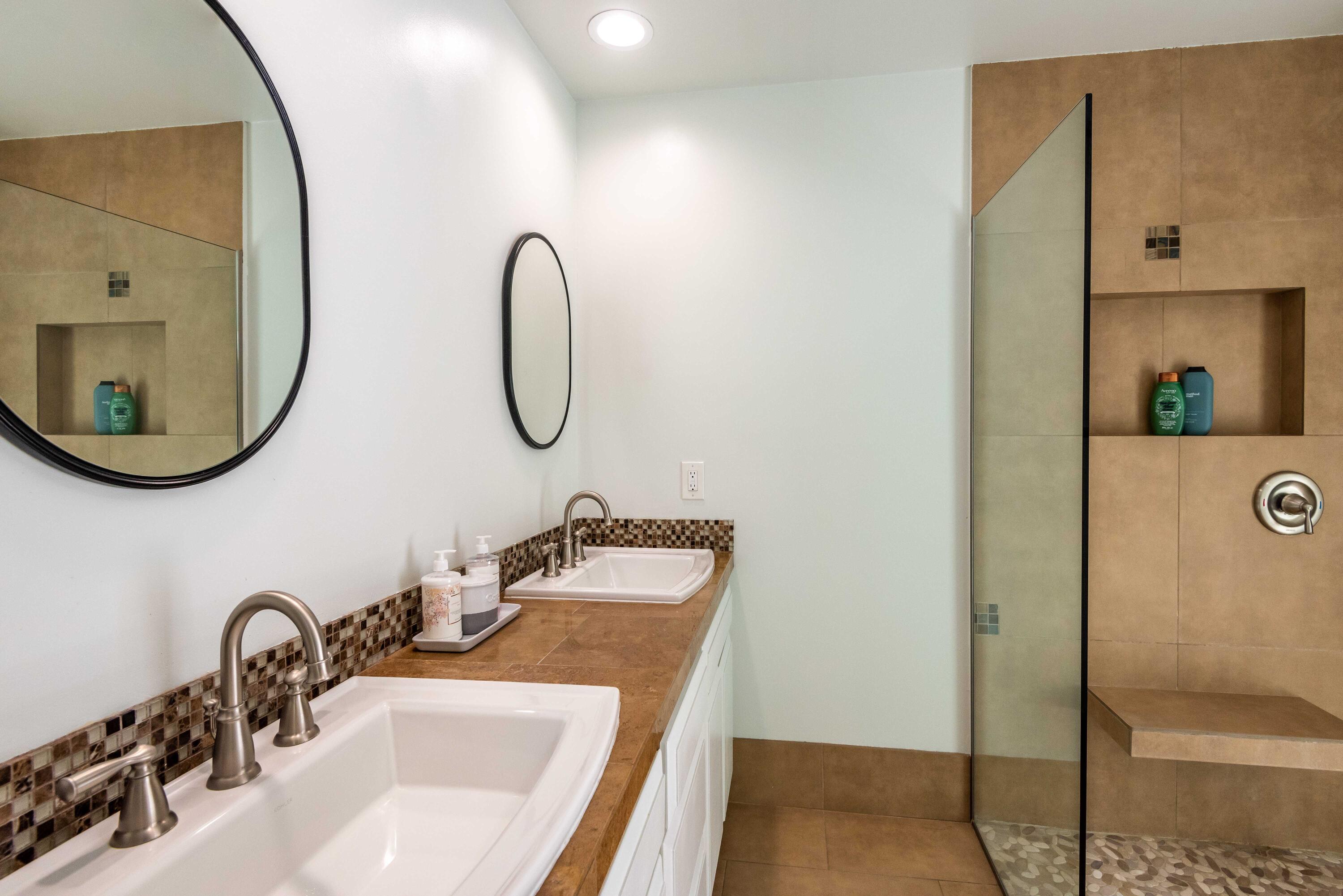 263 East Morongo Road Palm Springs, CA 92264 - Photo 23 of 29 a bathroom with a sink and a mirror