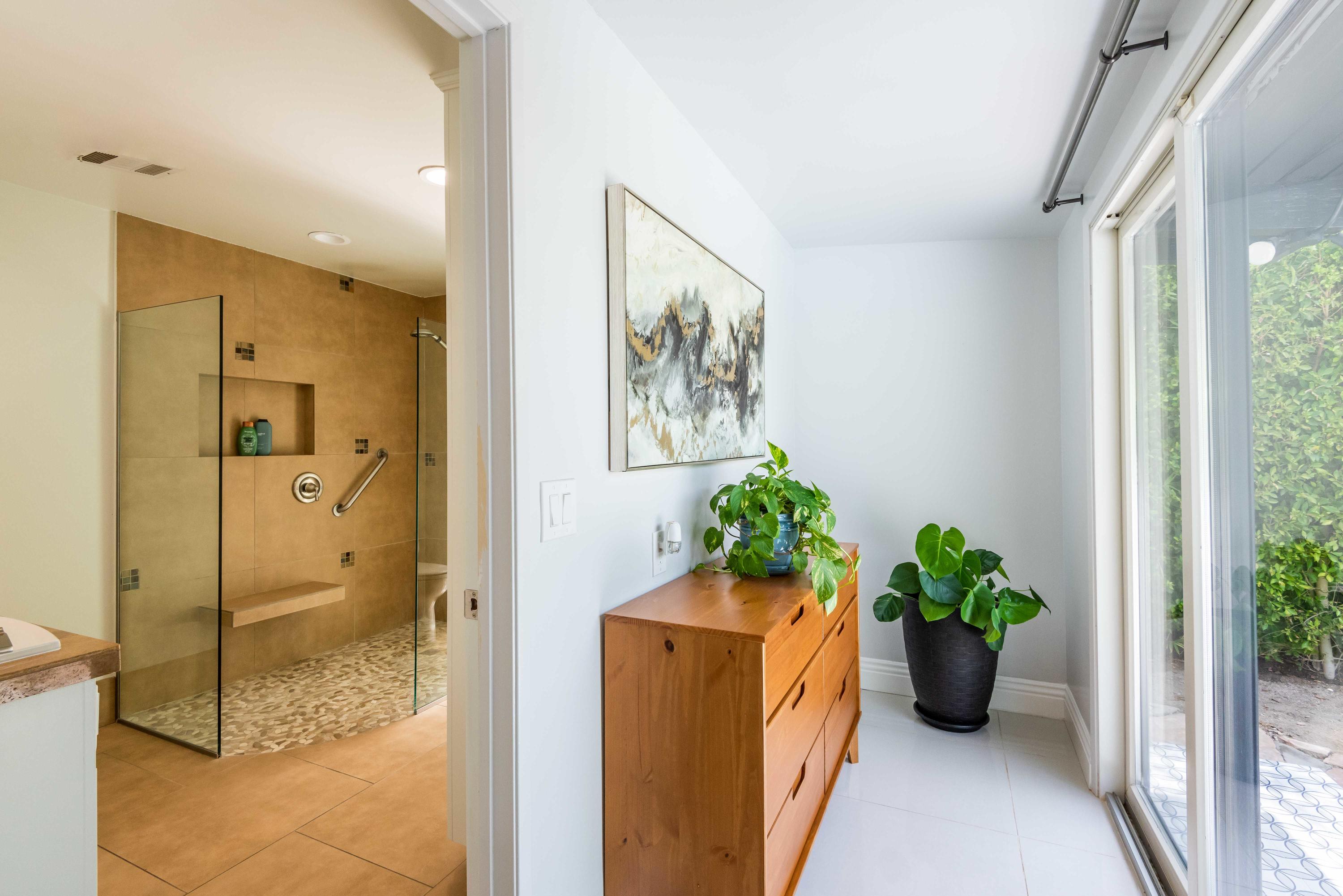 263 East Morongo Road Palm Springs, CA 92264 - Photo 25 of 29 a view of a hallway with wooden floor and a potted plant