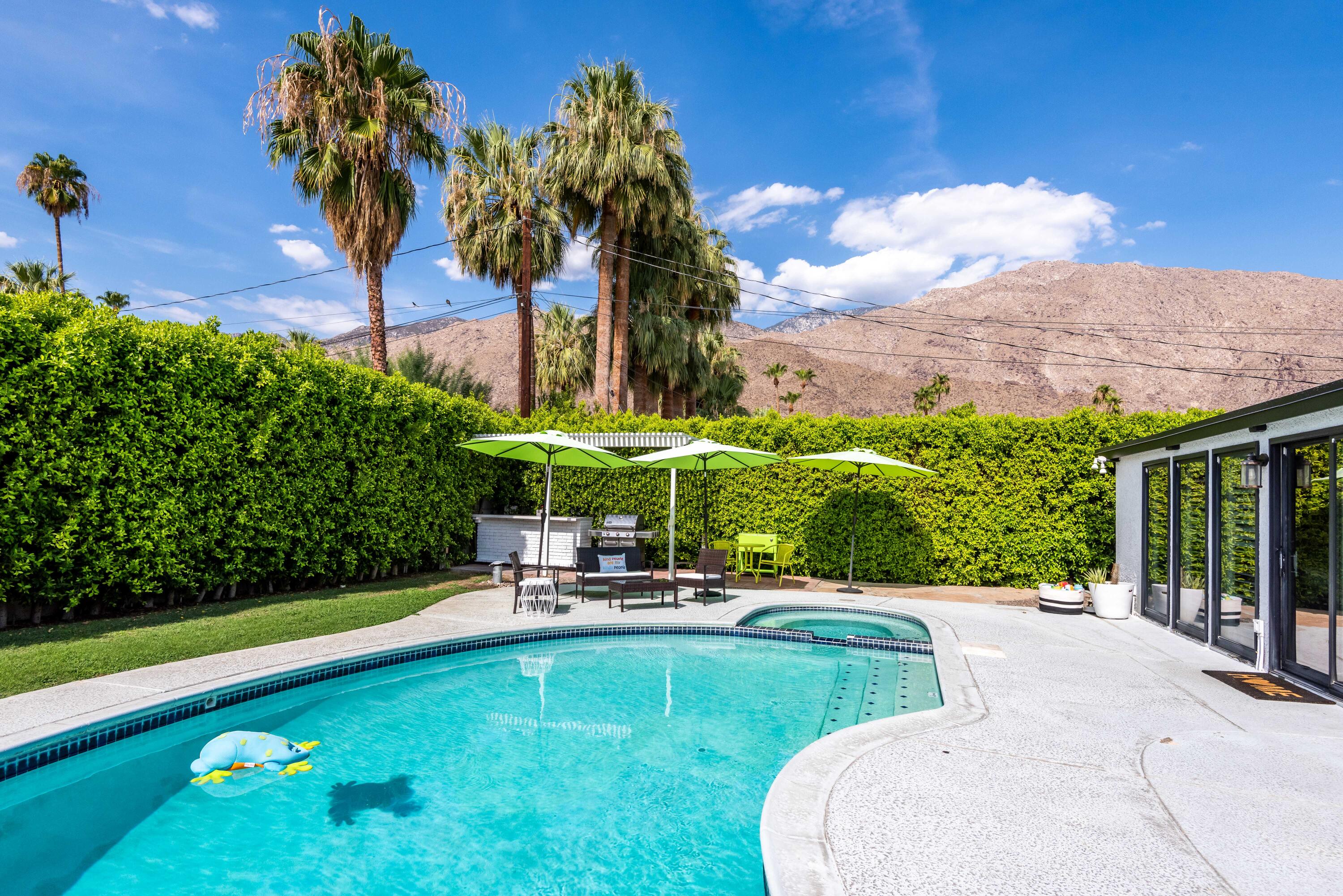 263 East Morongo Road Palm Springs, CA 92264 - Photo 28 of 29 a view of a swimming pool with a garden and plants