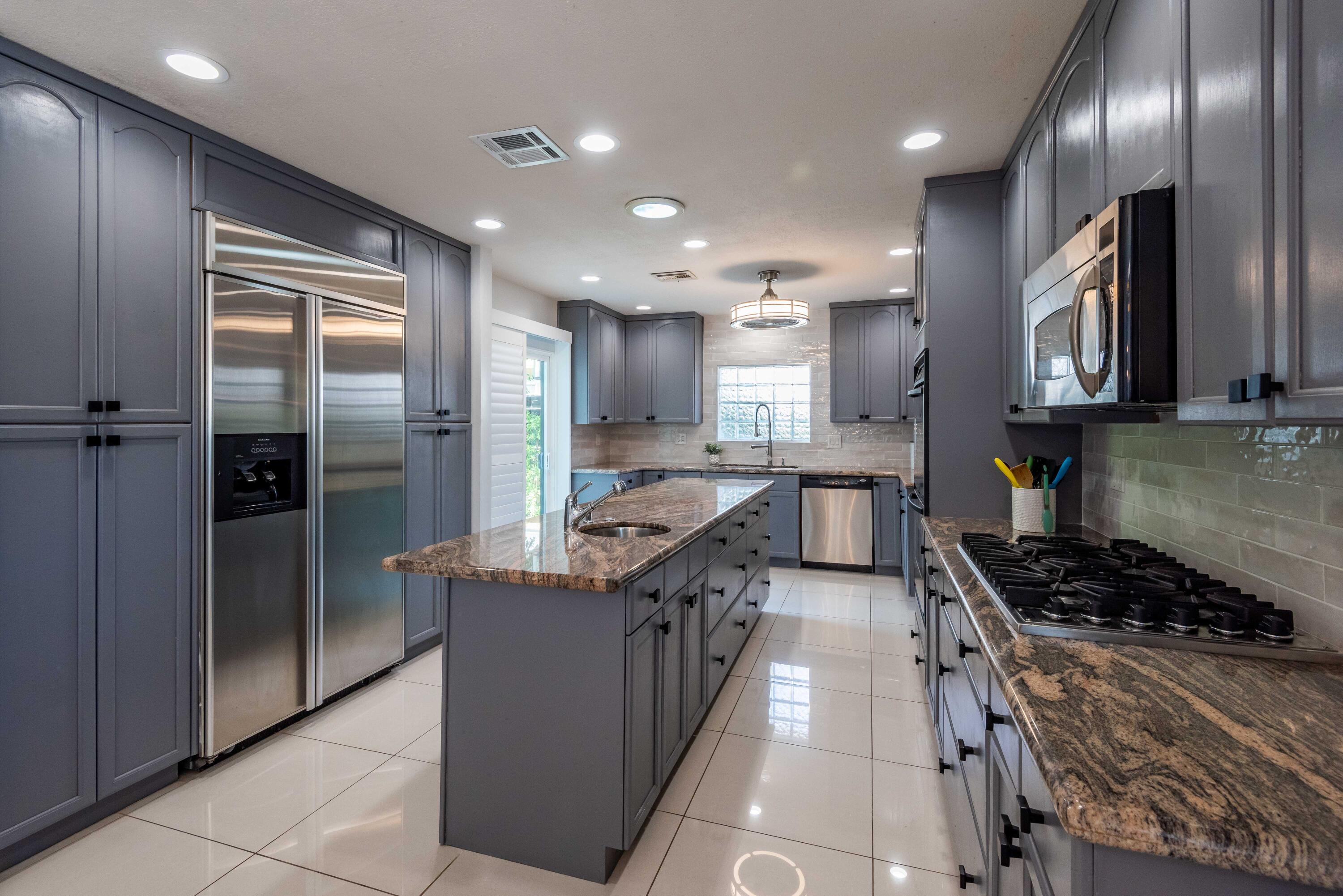 263 East Morongo Road Palm Springs, CA 92264 - Photo 9 of 29 a kitchen with stainless steel appliances granite countertop a stove a refrigerator a sink and a stove