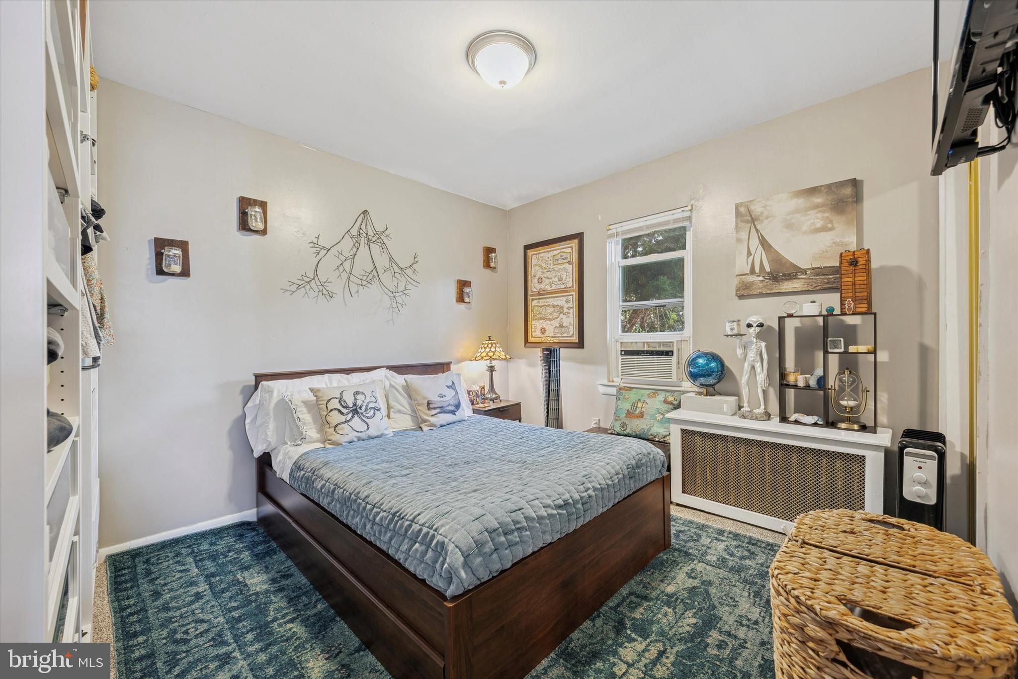 213 Greenfield Avenue Ardmore, PA 19003 - Photo 11 of 15 a bedroom with a bed and wooden floor