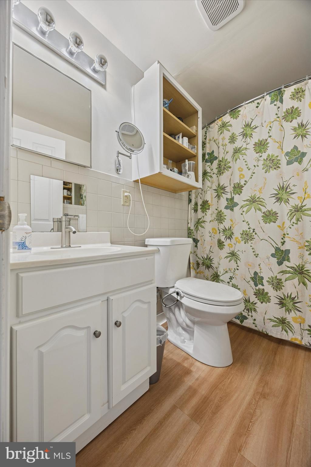213 Greenfield Avenue Ardmore, PA 19003 - Photo 12 of 15 a bathroom with a sink toilet and mirror