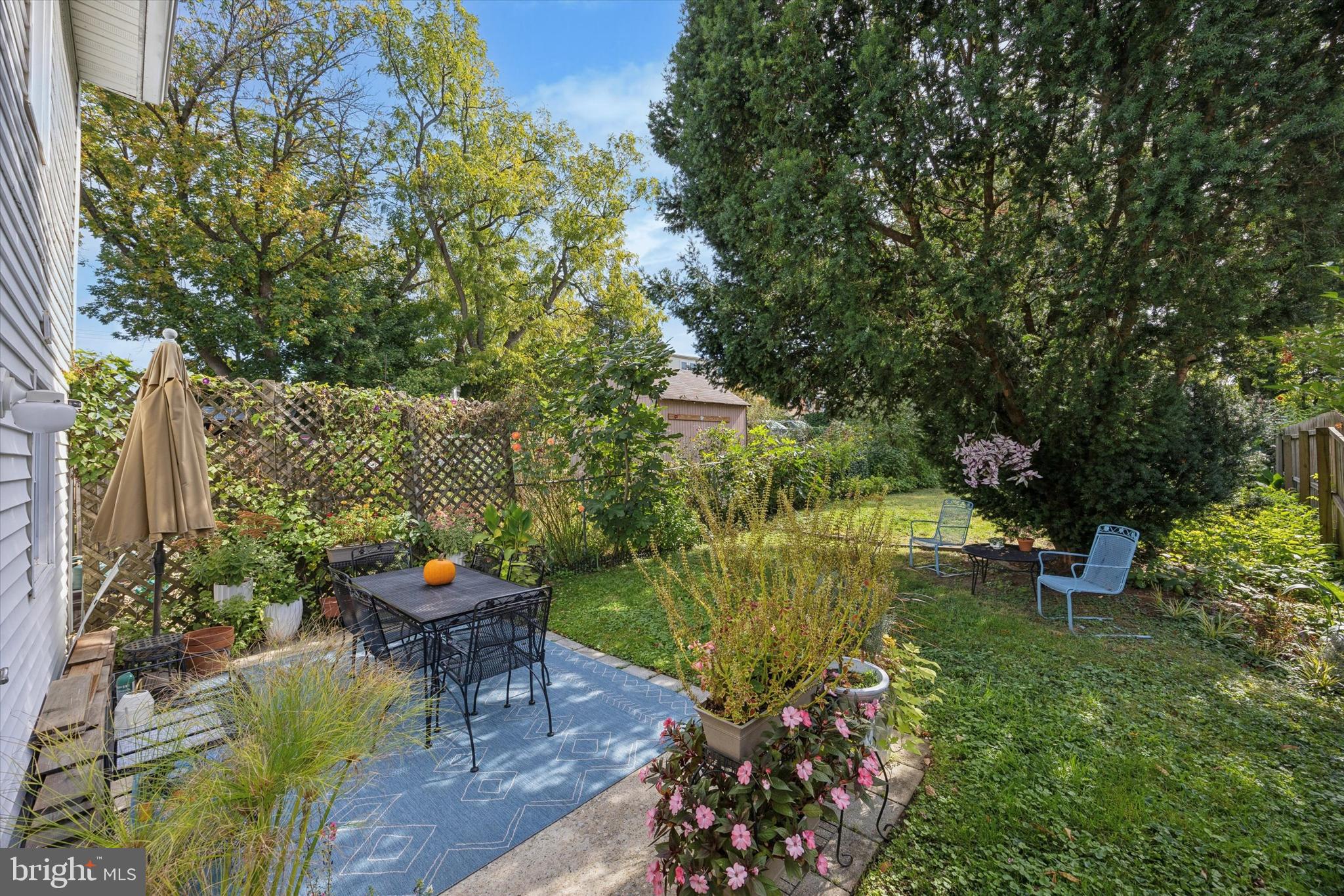 213 Greenfield Avenue Ardmore, PA 19003 - Photo 15 of 15 a view of a garden with plants and a bench