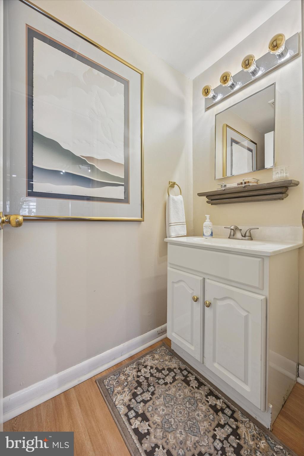 213 Greenfield Avenue Ardmore, PA 19003 - Photo 8 of 15 a room with a mirror sink and vanity