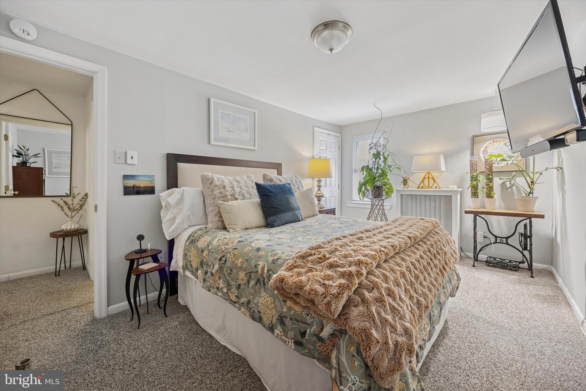 213 Greenfield Avenue Ardmore, PA 19003 - Photo 10 of 15 a bed room with a bed and chair