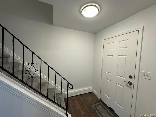 a view of staircase with wooden floor and staircase