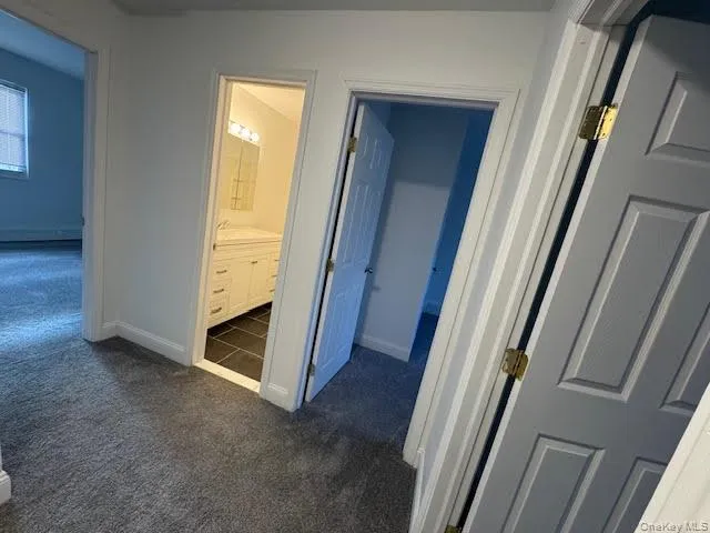 a bathroom with a sink toilet and mirror