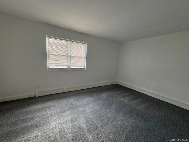 a bathroom with a toilet a sink a vanity and mirror