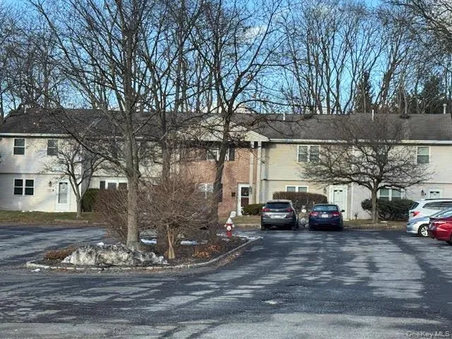 a view of a cars parked on the side of a road