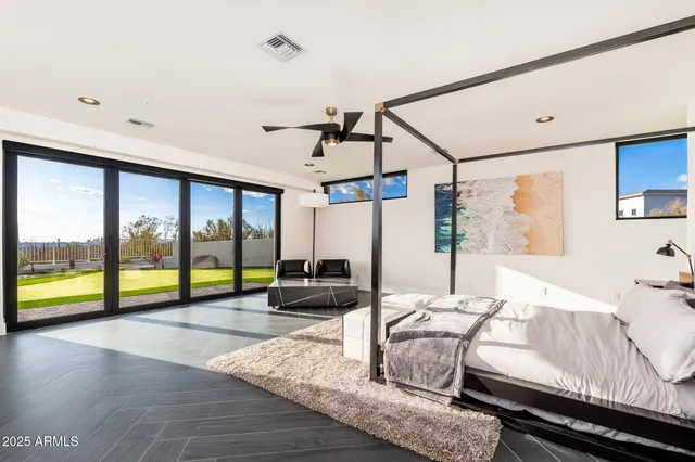 a bathroom with a granite countertop sink and a toilet