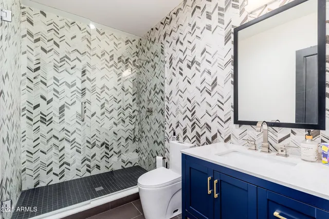 a terrace with outdoor seating and city view