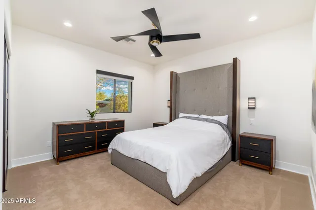 a view of a swimming pool and lake from a seating space