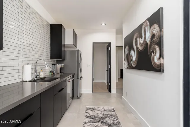 a view of a swimming pool and lounge chairs