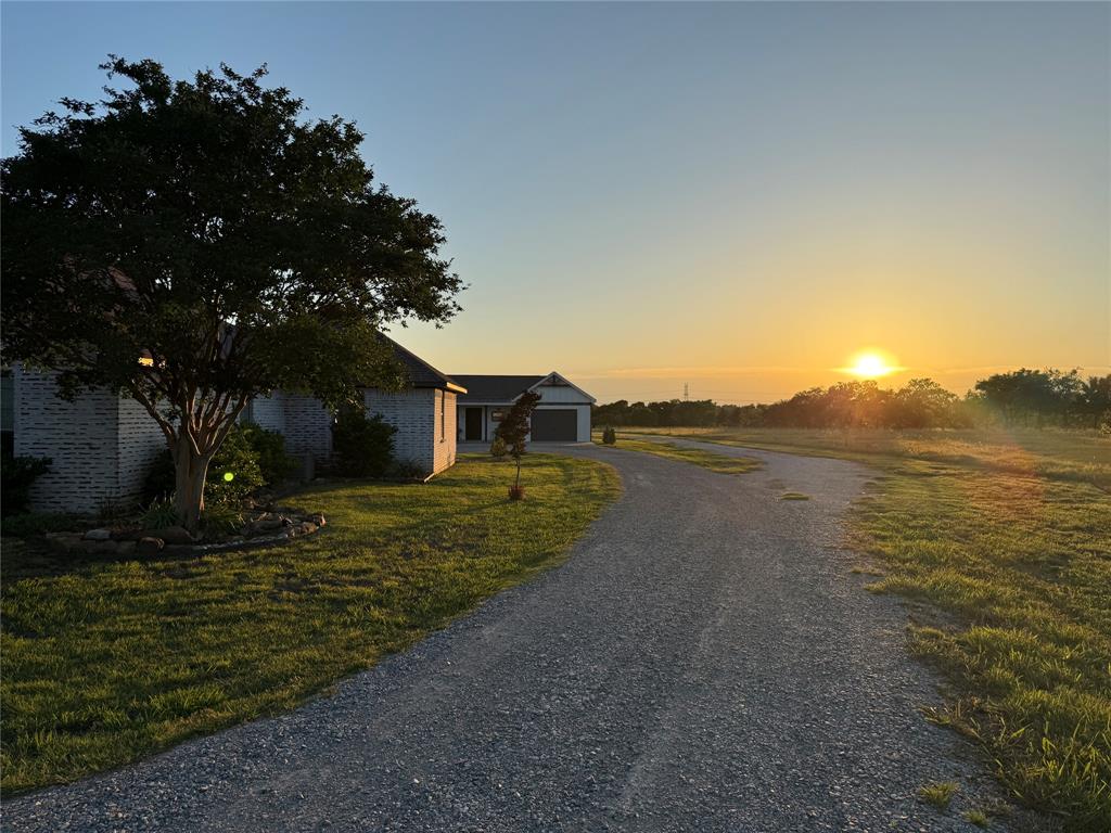 1177 Lone Star Road Celina, TX 75009 - Photo 2 of 28 a view of a house with a yard