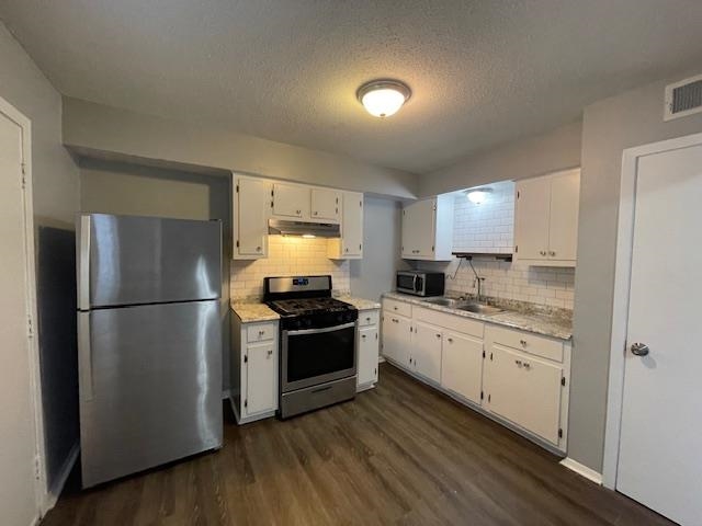 605 Patterson Street, Unit 9 Memphis, TN 38111 - Photo 4 of 10 a kitchen with a refrigerator sink and stove top oven