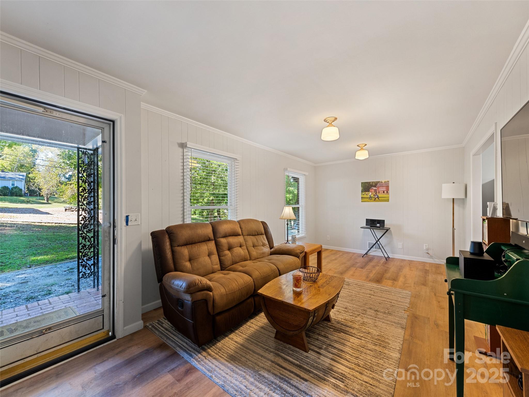 263 Blanton Street Columbus, NC 28722 - Photo 11 of 45 a living room with furniture and a wooden floor