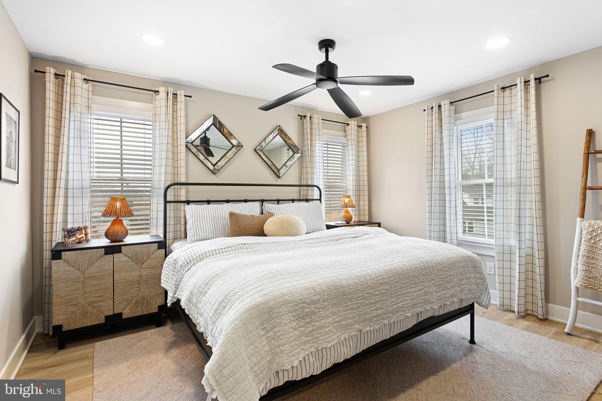 1 Maple Avenue Haddon Township, NJ 08108 - Photo 25 of 87 a bedroom with a bed next to a window and a chandelier