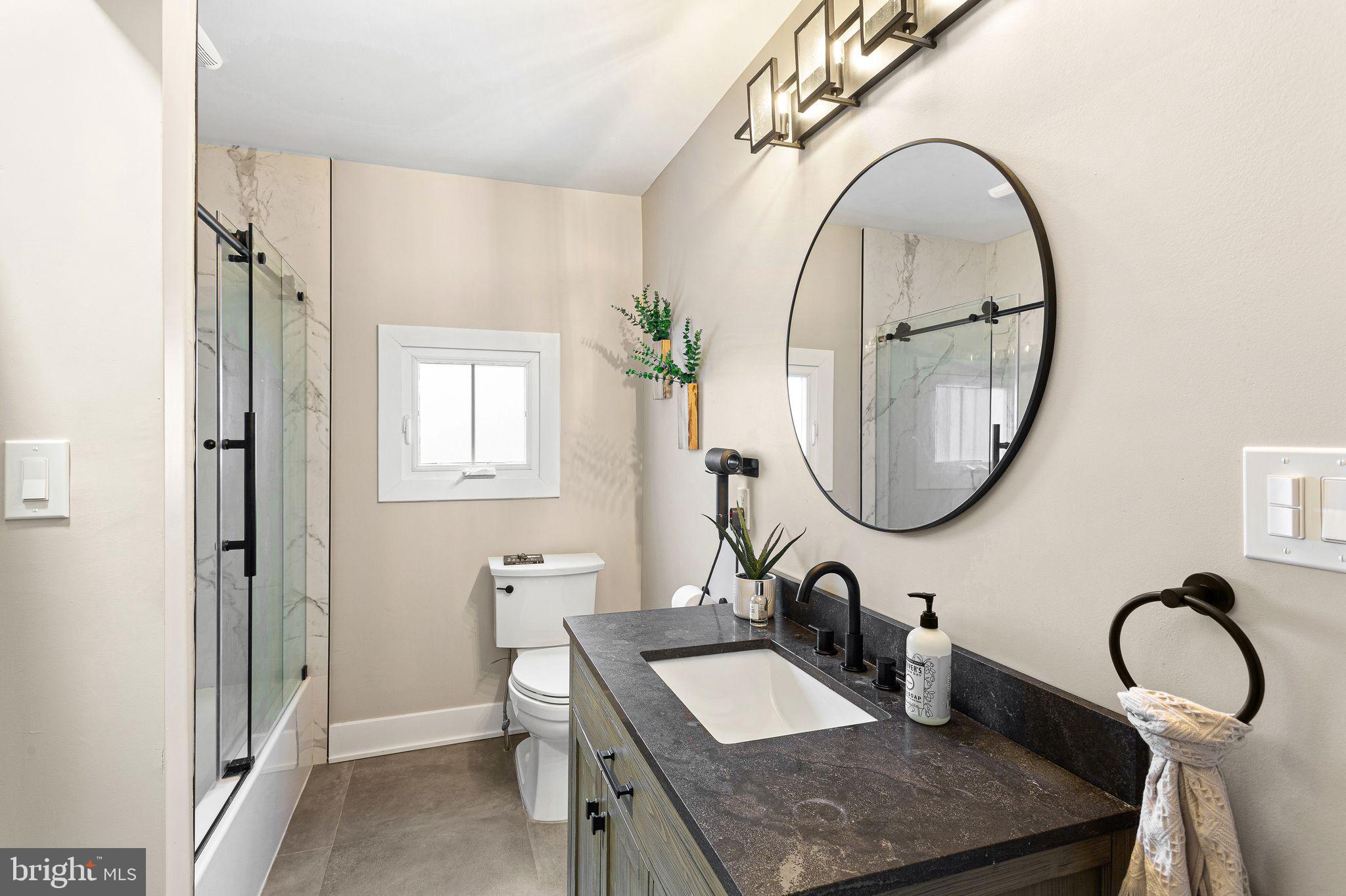 1 Maple Avenue Haddon Township, NJ 08108 - Photo 32 of 87 a bathroom with a sink and a mirror