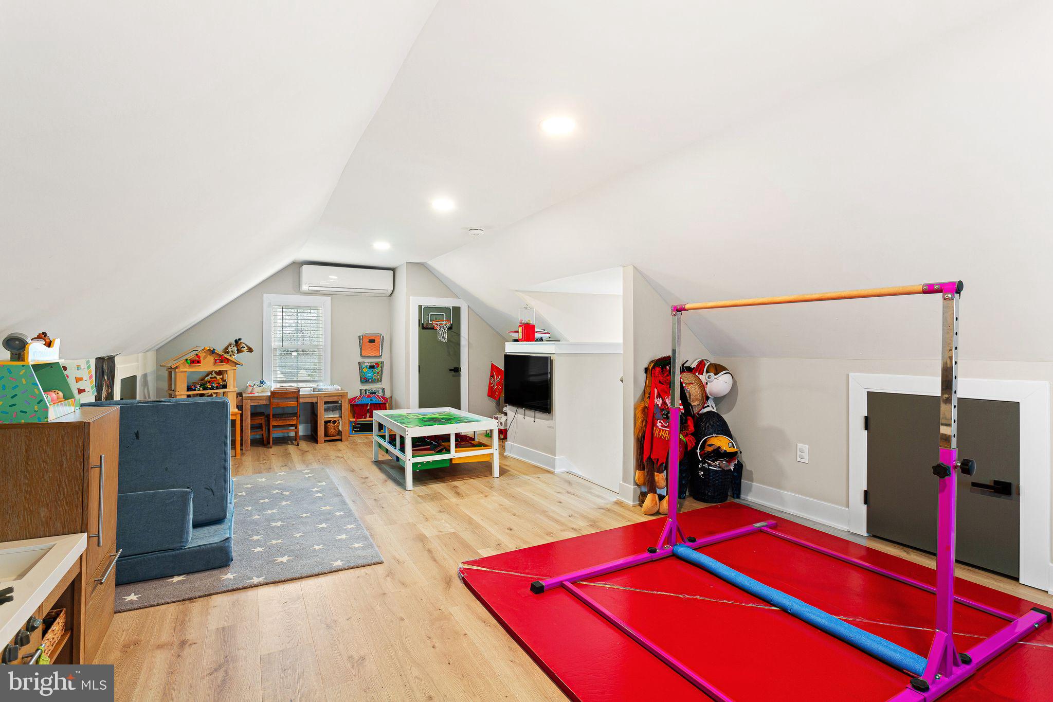 1 Maple Avenue Haddon Township, NJ 08108 - Photo 37 of 87 a living room with furniture a flat screen tv and gym equipment