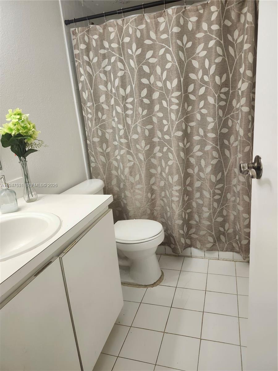 a bathroom with a toilet and a sink