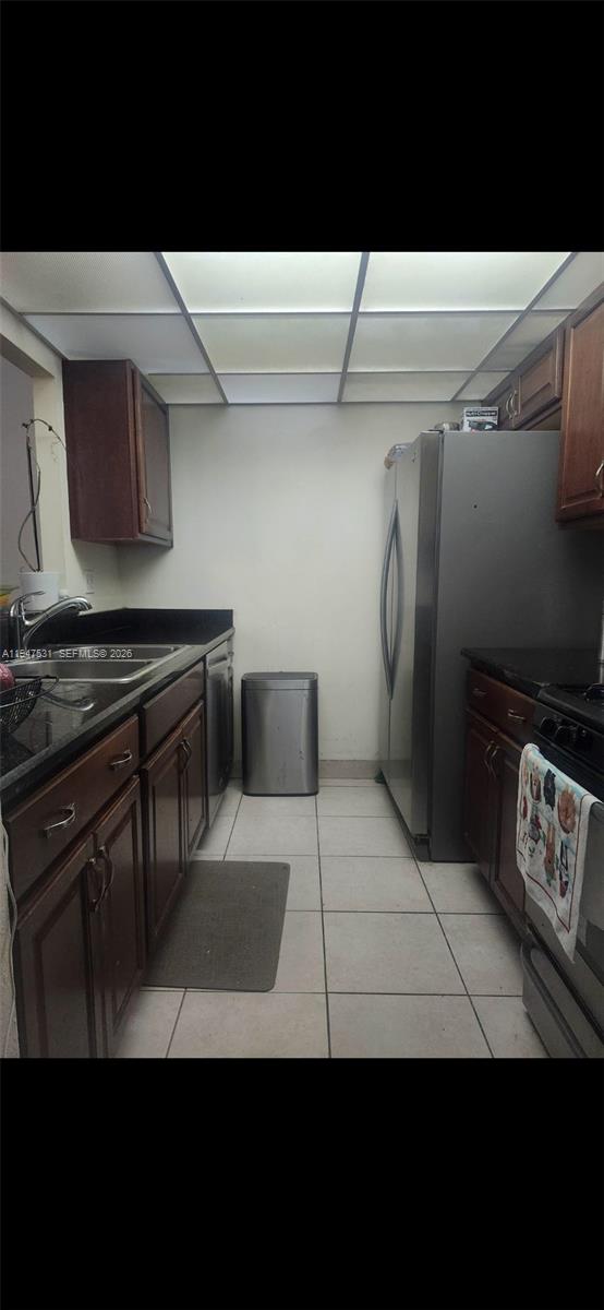 17901 Northwest 68th Avenue, Unit T103 Hialeah, FL 33015 - Photo 3 of 24 a view of kitchen with refrigerator