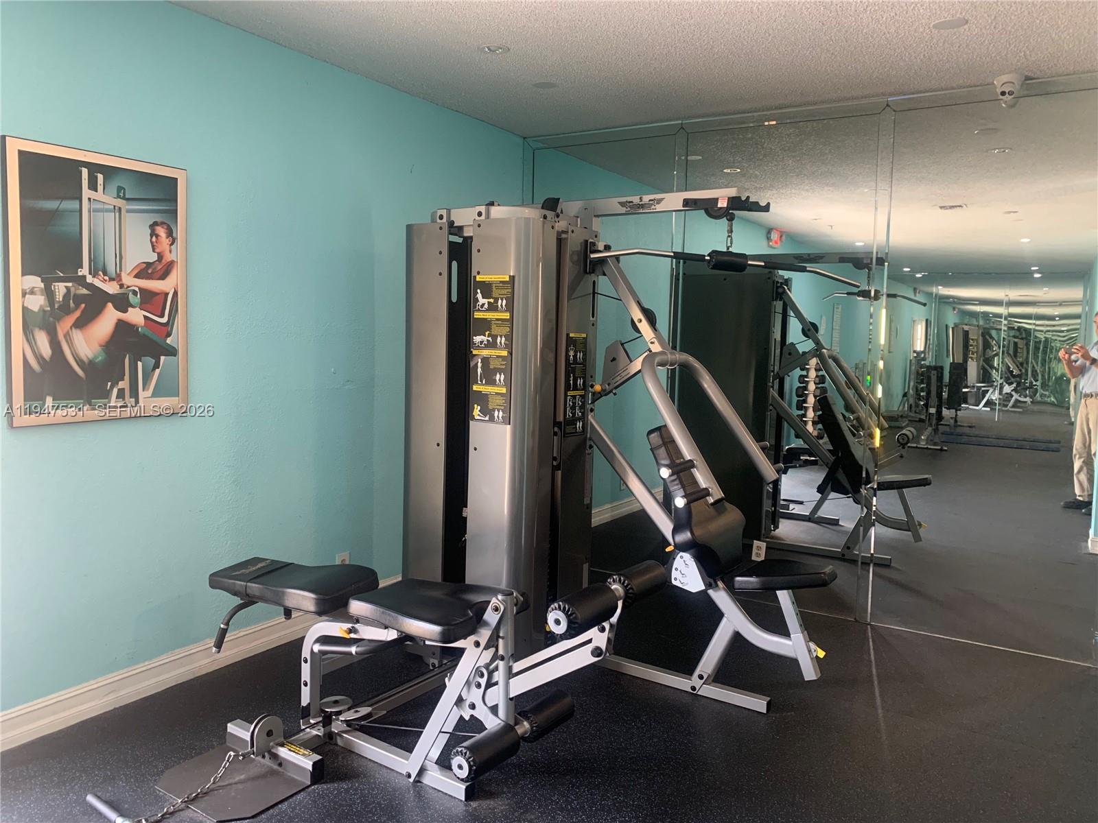 17901 Northwest 68th Avenue, Unit T103 Hialeah, FL 33015 - Photo 9 of 24 a view of a room with gym equipment