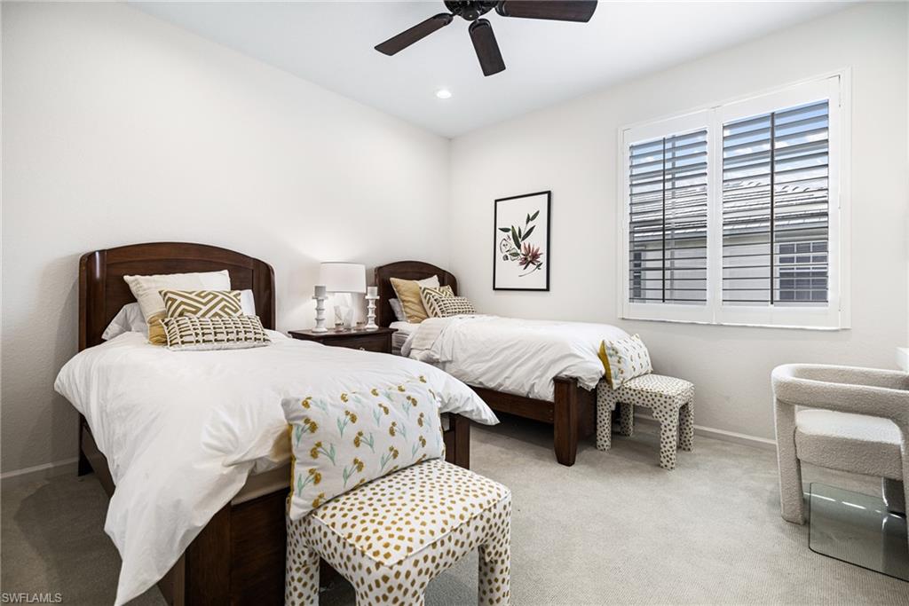 19071 Ridgepoint Drive, Unit 202 Estero, FL 33928 - Photo 12 of 26 Carpeted bedroom with ceiling fan