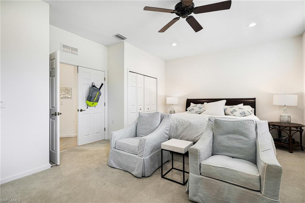 19071 Ridgepoint Drive, Unit 202 Estero, FL 33928 - Photo 14 of 26 Bedroom featuring light carpet and ceiling fan
