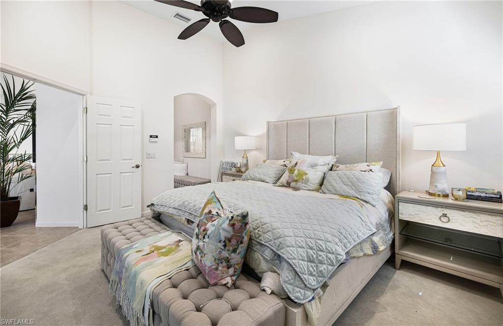19071 Ridgepoint Drive, Unit 202 Estero, FL 33928 - Photo 16 of 26 Carpeted bedroom featuring a high ceiling and ceiling fan