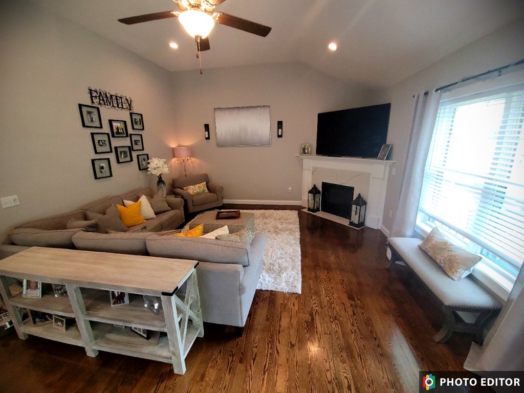 70 Ryan Farm Road, Unit 13 Windham, NH 03087 - Photo 8 of 13 a living room with furniture and a flat screen tv