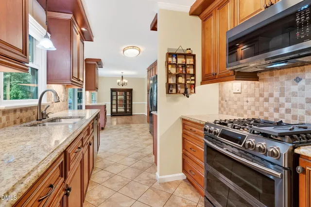 a kitchen with a stove and a sink
