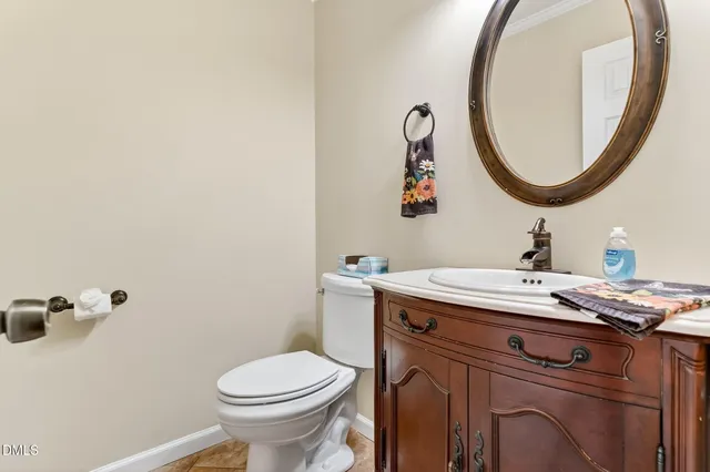 a view of a bathroom with a sink and a mirror